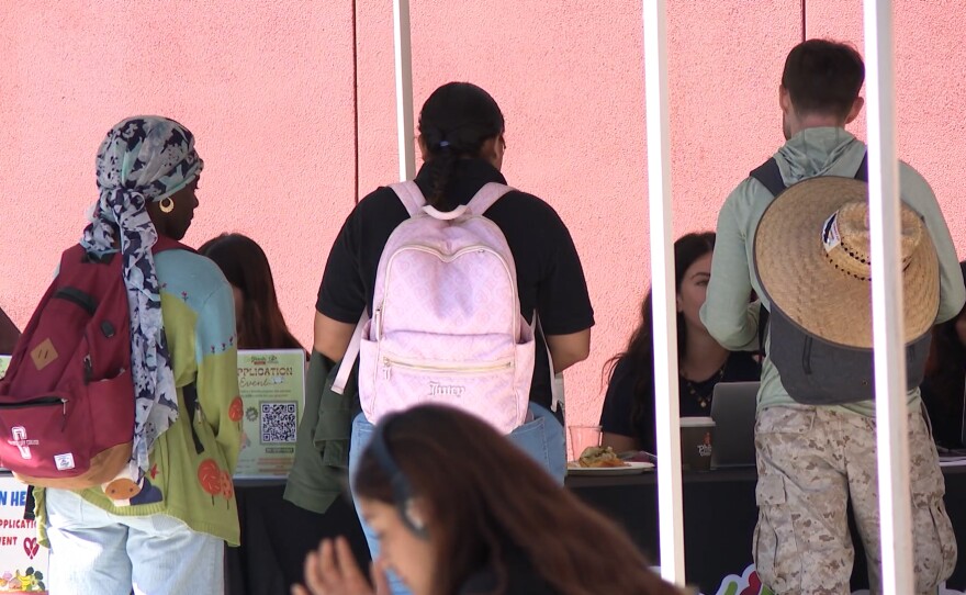 San Diego City College students speak with Basic Needs Center staff at a CalFresh application event on Tuesday, Oct. 28, 2025.