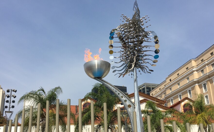The Olympic flame burns along the waterfront in Rio, duplicating the flame that was lit in Maracana stadium on Friday.