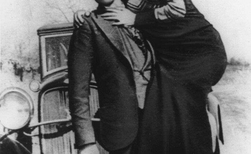 Clyde Barrow holds his partner-in-crime, Bonnie Parker.