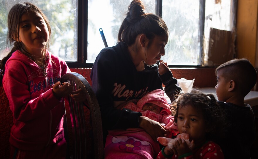 Gema Judith Olvera Chavez is shown with her four children at the Border Line Crisis Center in Tijuana, Dec. 21, 2022. She fled violence in her home state of Michoacán.