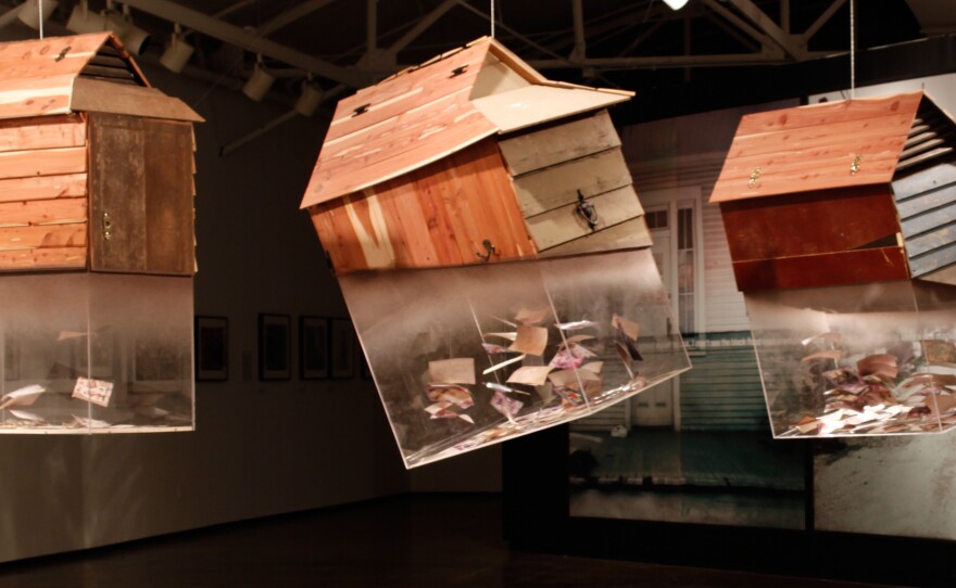 Rontherin Ratliff's Things that Float sculpture contains photographs he rescued from his grandmother's drowned house.