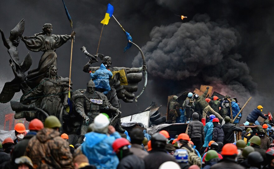 Anti-government protesters continue to clash with police in Independence square, despite a truce agreed between the Ukrainian president and opposition leaders on Feb. 20, 2014, in Kyiv.