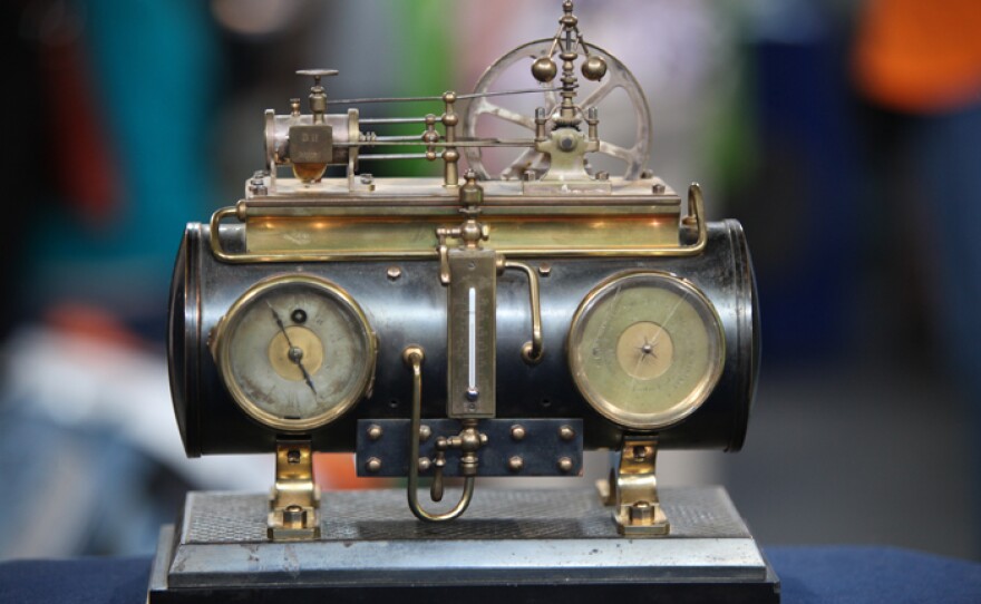 Sean Delaney appraises a French Industrial steam boiler clock in Omaha, Neb.