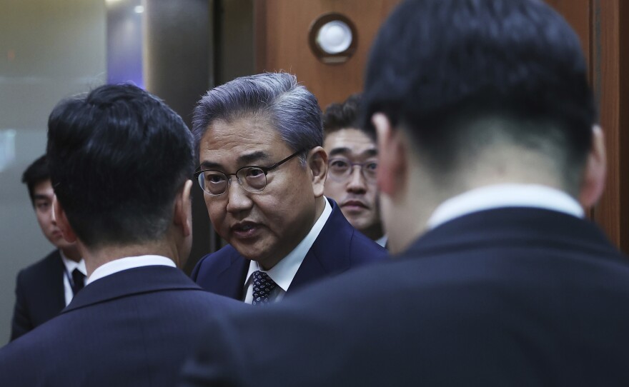 South Korean Foreign Minister Park Jin, center, leaves after a briefing announcing a plan on Monday to resolve a dispute over compensating people forced to work under Japan's 1910-1945 occupation of Korea, at the Foreign Ministry in Seoul, South Korea Monday, March 6, 2023.