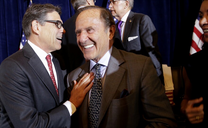 In a photo from 2015, then-Republican presidential candidate, former Texas Gov. Rick Perry, greets New York Daily News publisher Mortimer Zuckerman during a luncheon hosted by the Committee to Unleash Prosperity, at the the Yale Club in New York.