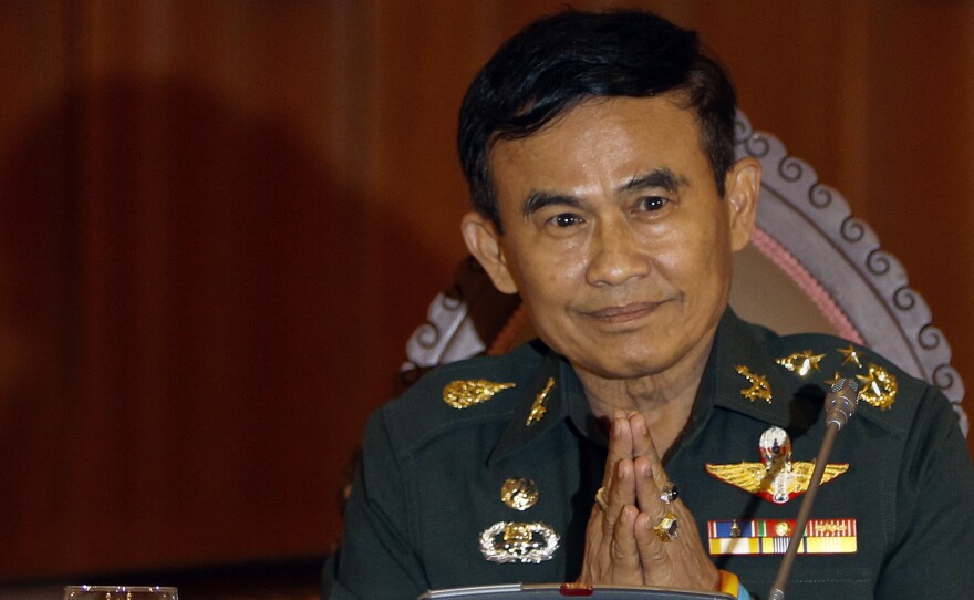 Thailand's Justice Minister Gen. Paiboon Koomchaya tells Reuters that martial law will remain in place "indefinitely."