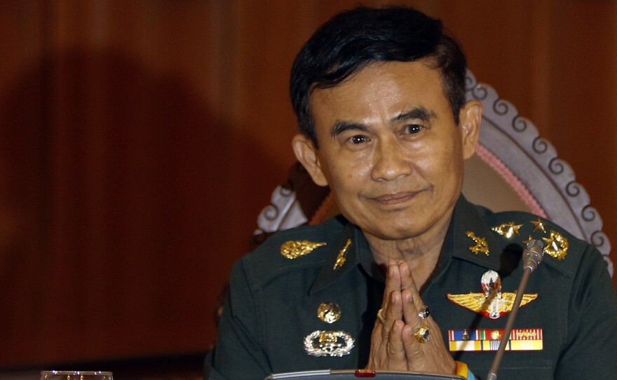 Thailand's Justice Minister Gen. Paiboon Koomchaya tells Reuters that martial law will remain in place "indefinitely."