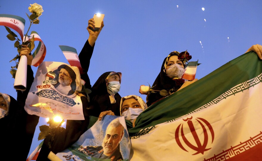 Supporters of Iranian president-elect Ebrahim Raisi celebrate after he won the presidential election in Tehran on Saturday.