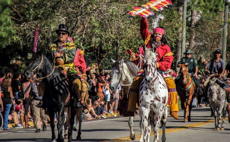 Moses Jumper, a Seminole re-enactor from Big Cypress Reservation, and an FSU student portraying Osceola lead the 2015 FSU Homecoming parade.