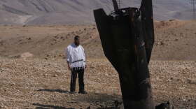 A man look at the wreckage of an Iranian missile that landed near the West Bank city of Jericho Monday, June 8, 2026.
