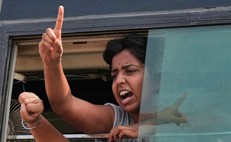 A protester shout slogans as they are detained and taken in a police vehicle during a protest demanding the resignation of Chief Election Commissioner Gyanesh Kumar in New Delhi, India, Saturday, Oct. 10, 2026.