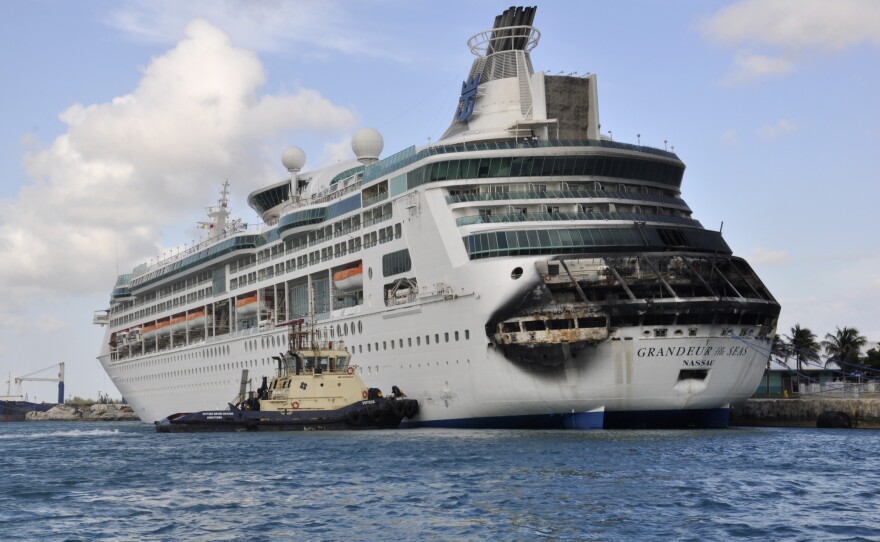 Damage on the Royal Caribbean ship Grandeur of the Seas is visible as the ship docks in Freeport, the Bahamas, on Monday.