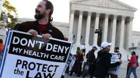 A protester stands outside the U.S. Supreme Court Building on March 26, 2012 in Washington, DC. 