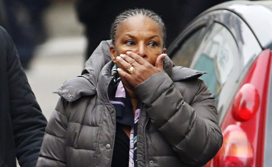 French Justice Minister Christiane Taubira reacts to the scene after the attack.