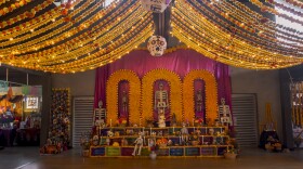 The community altar for Día de Muertos at the Sherman Heights Community Center offers people milk crate-sized spots to create their own mini-altar to honor loved ones who have passed on, Oct. 15, 2024.