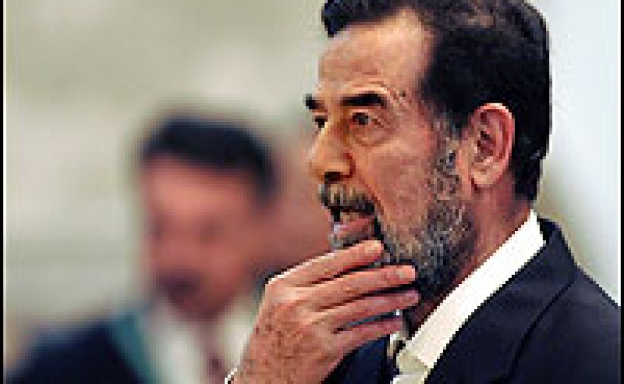 Saddam Hussein, shown here on March 15 at his trial in Baghdad, was getting inside information from Russian sources, a Pentagon report says. But it wasn't accurate.