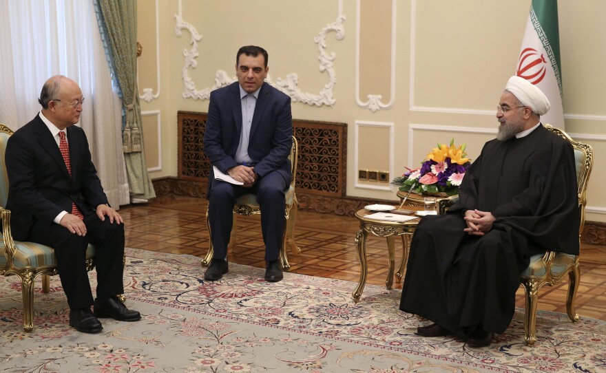 Iranian President Hassan Rouhani (right) meets with U.N. nuclear chief Yukiya Amano (left) and an unidentified interpreter in Tehran, Iran, last month to discuss the country's nuclear program.