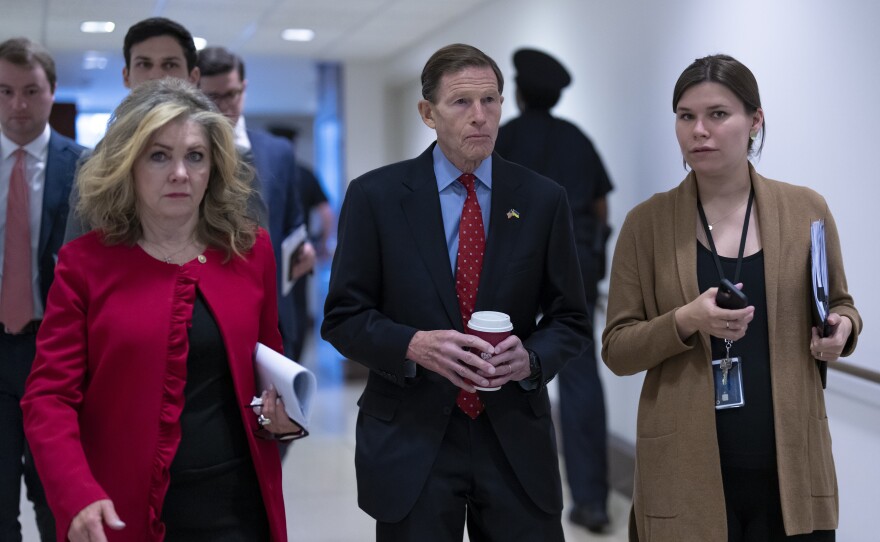 Sen. Marsha Blackburn, R-Tenn., left, and Sen. Richard Blumenthal, D-Conn., head to a secure area as lawmakers and intelligence advisers arrive for a closed briefing on the unknown aerial objects the U.S. military shot down this weekend at the Capitol on Tuesday morning.