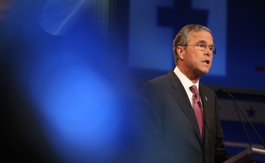 Former Gov. Jeb Bush, R-Fla., speaks during the first Republican presidential debate Thursday in Cleveland. Bush touted his jobs record in Florida, but there's more to it.