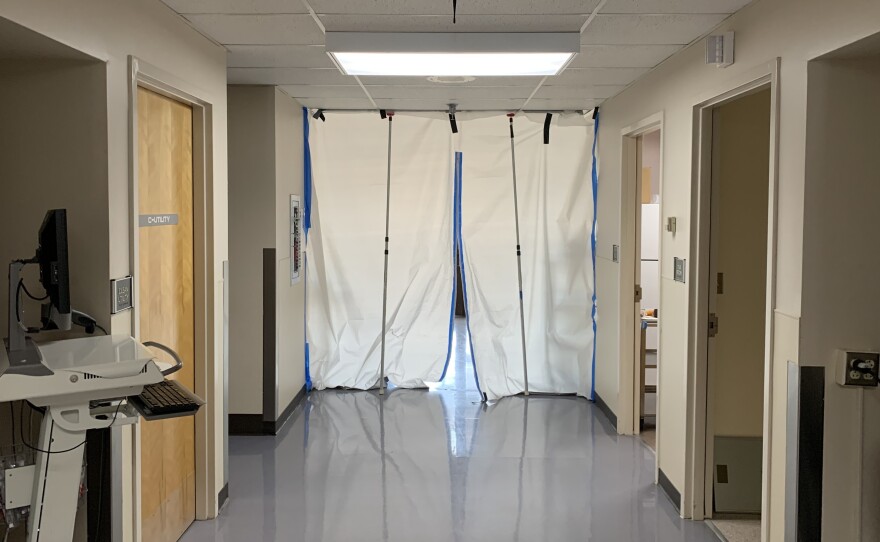 A hallway leads to a makeshift isolation ward for COVID-19 patients.