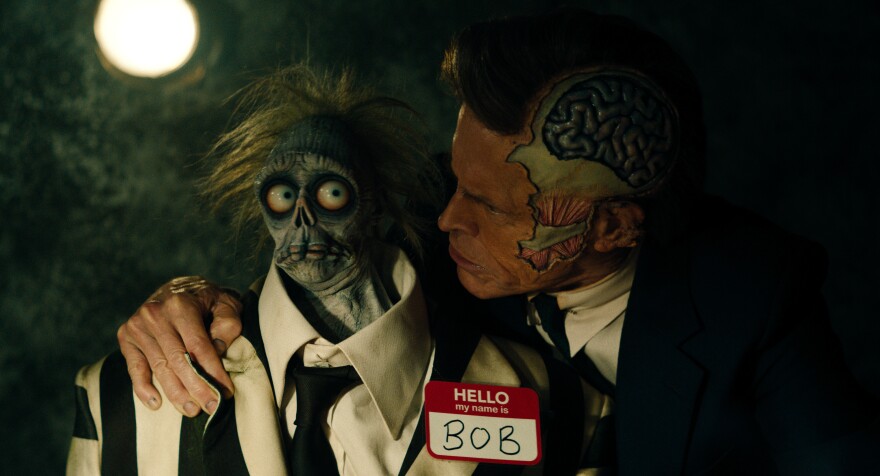 Wolf Jackson (Wllem Dafoe) and and the put-upon Bob (Nick Kellington) in "Beetlejuice Beetlejuice."