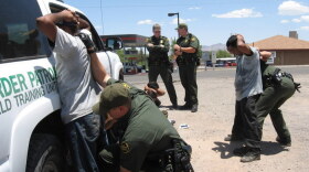 Border patrol agents arrest immigrants in 2007 who had recently crossed the border from Mexico into Nogales, Ariz. Federal programs like Operation Streamline put border-crossers without other prior criminal records through the federal court system.