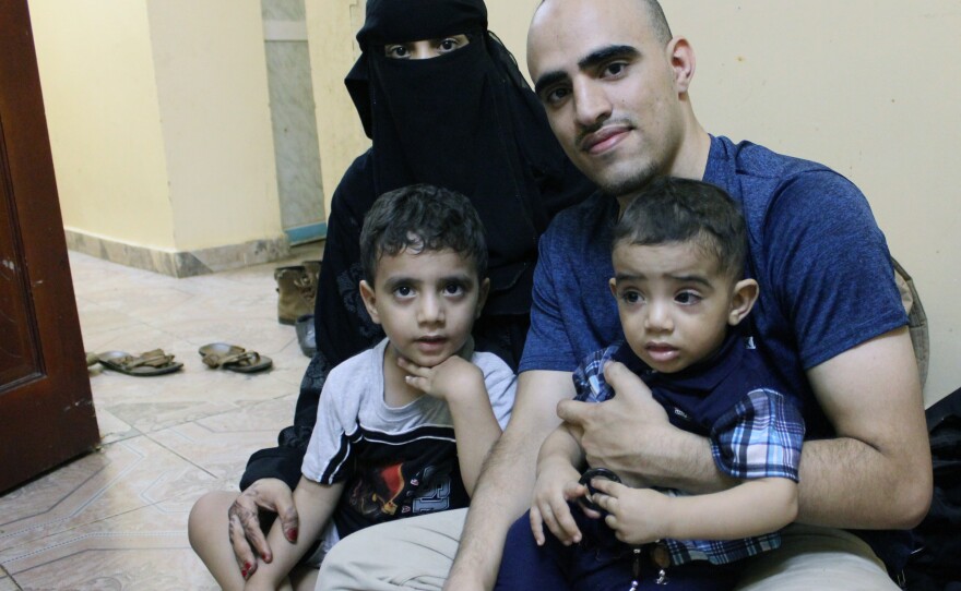 Amr Mozeb, shown here with his wife Wahdeh and their two sons at their home in Djibouti, spent his high school and college years in the U.S. and was naturalized as a teenager. His children are U.S. citizens, but his wife, a Yemeni national, has been denied a U.S. visa.