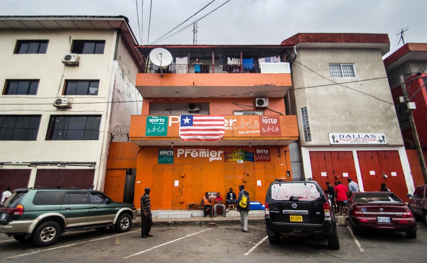 Many business around Liberia have shut down during the Ebola epidemic. A notice to customers on the locked metal gates of Mercury Betting Company says the measure was taken to prevent the spread of the virus.