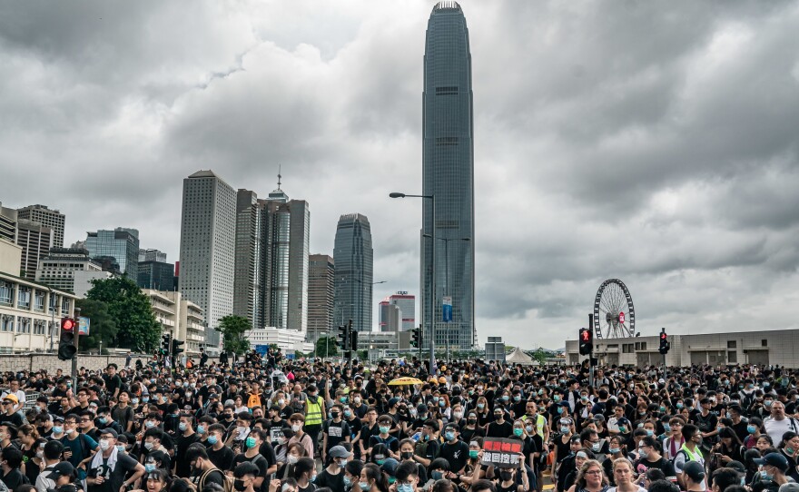 Protesters demonstrate outside the Chief Executive Office on Monday in Hong Kong.