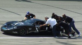 Students from West Philly High push their hand-crafted hybrid sports car on to a Michigan speedway as they compete to win a $10 million dollar prize.