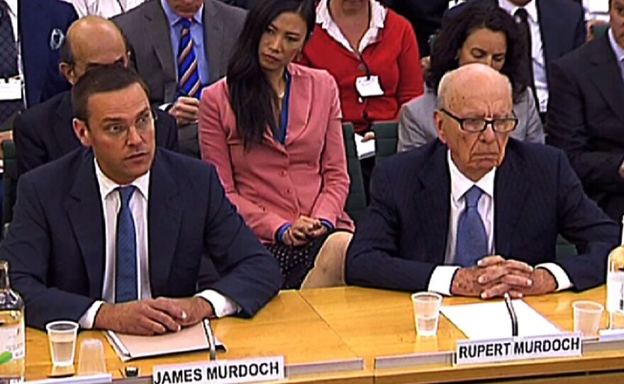 News Corp. CEO Rupert Murdoch (right), testifying alongside his son James, said his appearance Tuesday before a British parliamentary inquiry in London was "the most humble day of my life."