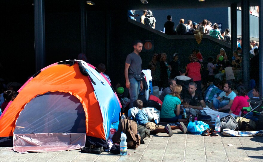 Families camp outside Keleti station in Budapest after the Hungarian government prevented them from traveling.