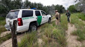 U.S. Customs and Border Air and Marine agents and U.S. Customs and Border Protection agents compare notes as they patrol near the Texas-Mexico border, near McAllen, Texas, Sept. 5, 2014.  