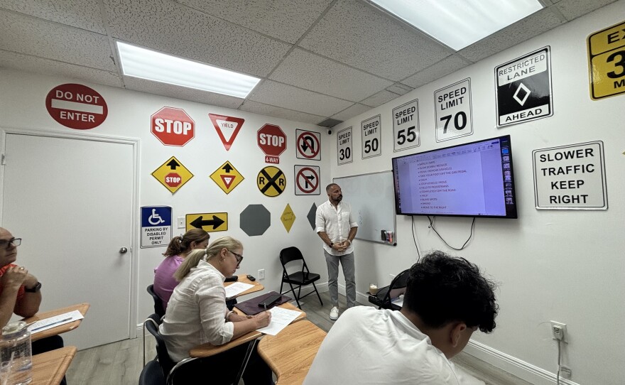 Johannes González, an instructor at Speedway Driving School in Hialeah, Florida, teaches Spanish-speaking students to memorize key words in order to pass the state's new English-only driving exam.