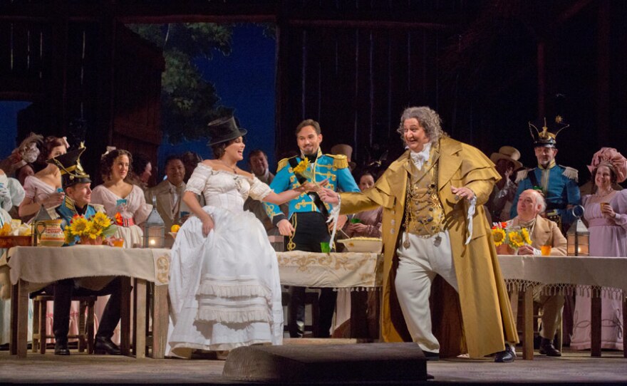 Anna Netrebko as Adina, Mariusz Kwiecien as Sergeant Belcore, and Ambrogio Maestri as Doctor Dulcamara in Donizetti’s “L’Elisir d’Amore.”