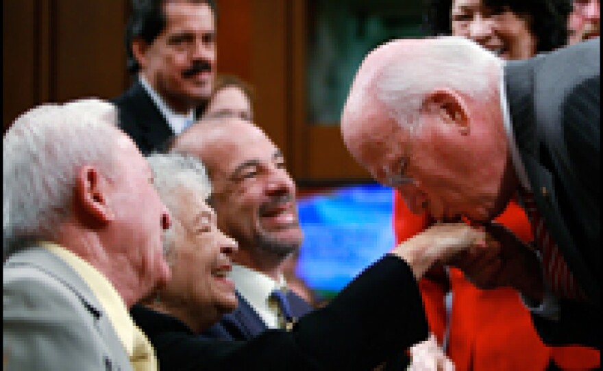 Senate Judiciary Committee Chairman Sen. Patrick Leahy, a Democrat from Vermont, kisses the hand of Celina Sotomayor, Sotomayor's mother, before the start of the second day of hearings.