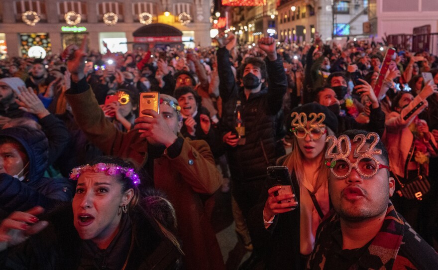 People celebrate during New Year's celebrations at Madrid's Puerta del Sol in downtown Madrid, Spain, early Saturday.