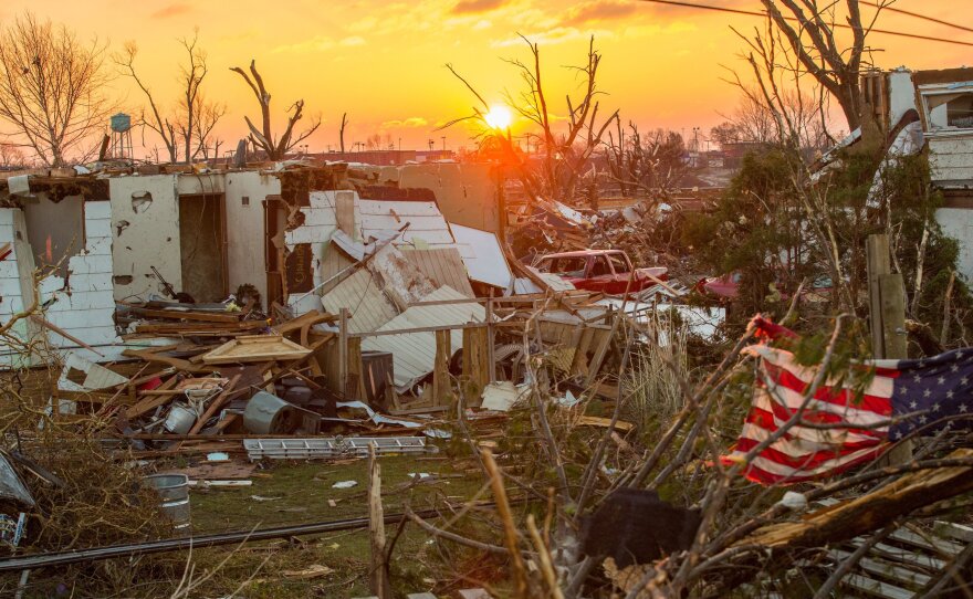 Washington, Ill., sits in ruins as the sun rises Monday, a day after a severe tornado tore through the community.