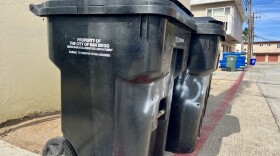 Trash bins stand in an alley in Ocean Beach, Sept. 17, 2025.