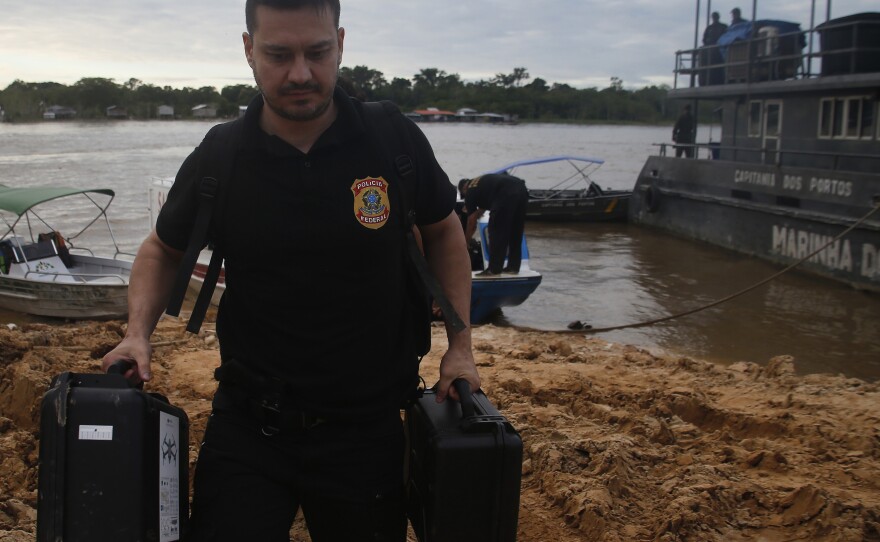 Federal police officers arrive at the pier after searching for Indigenous expert Bruno Pereira and freelance British journalist Dom Phillips in Amazonas state, Brazil, June 14, 2022.