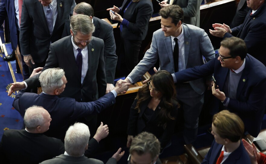 Rep-elect Tim Burchett (R-TN) (2nd-L), Rep.-elect Matt Gaetz (R-FL) (C) and Rep.-elect George Santon (R-NY) (R) congratulate House Republican Leader Kevin McCarthy (R-CA) (L) after he is elected Speaker of the House.