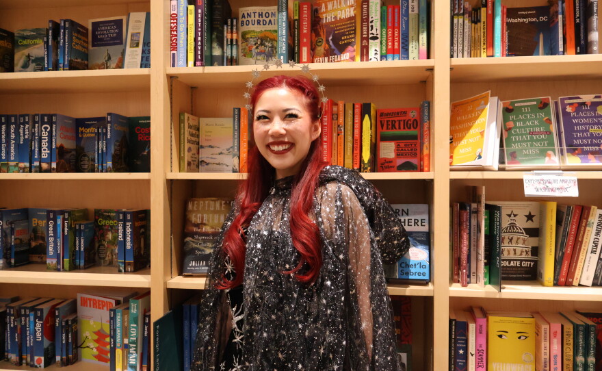 Ivana Wong's black dress adorned with sequin stars, a silver headpiece and a sheer, flowy cape won the night's costume contest.