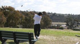 A golfer practices his driving swing on the Center City Golf Course in Oceanside, June 2014. Locals call the course "Goat Hill" because of its hilly terrain.