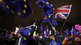 Anti-Brexit demonstrators react after the results of the vote on British Prime Minister Theresa May's Brexit deal were announced in Parliament square in London on Tuesday. British lawmakers have rejected Prime Minister Theresa May's Brexit deal by a huge margin, plunging U.K. politics into crisis 10 weeks before the country is due to leave the European Union.