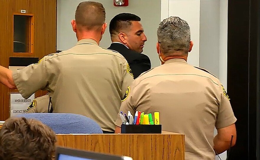 Deputy_Arrested_PKG.00_00_58_20.Still001_t800.jpg