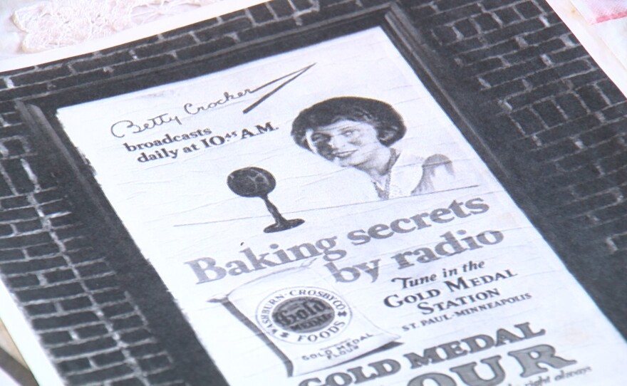 A vintage magazine ad of Betty Crocker at her radio mic is shown on December 1, 2023.