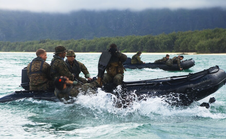 U.S. Marines with 4th Force Reconnaissance Company slide off F470 Combat Rubber Raiding Crafts during training in Waimanalo, Hawaii. The French company Zodiac has been the U.S. military's choice for inflatable rubber rafts for roughly two decades. Now the company is making the rafts in the U.S.