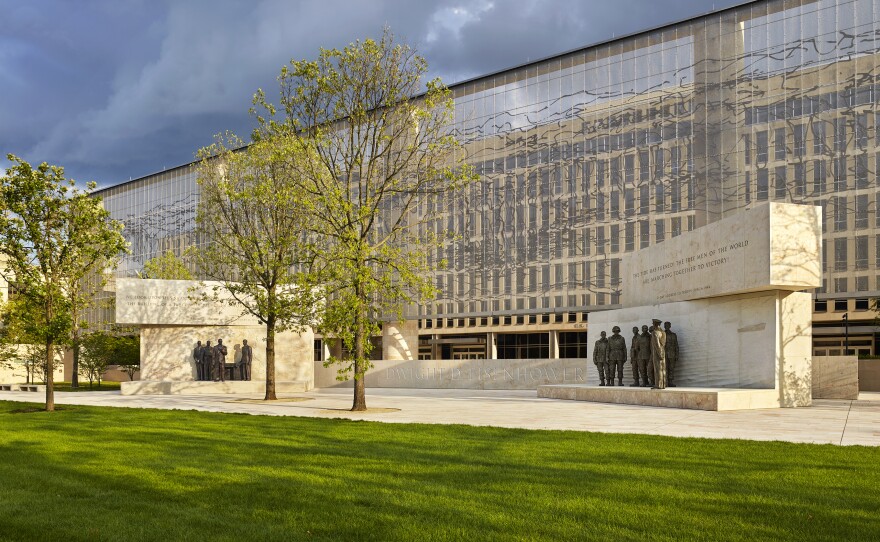 The Dwight D. Eisenhower Memorial in Washington, D.C., will be dedicated on Thursday. A stainless steel, woven "tapestry" made by artist Tomas Osinski stands behind the statues and depicts the cliffs at Normandy. Memorial design by Gehry Partners, sculpture by Sergey Eylanbekov and inscriptions by Nick Benson.