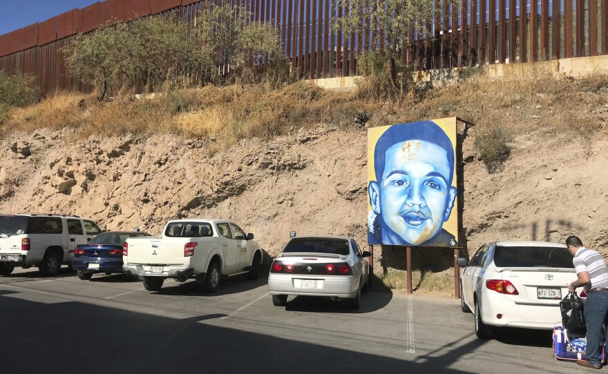 A portrait of 16-year-old Mexican youth Jose Antonio Elena Rodriguez, who was shot and killed in Nogales, Sonora, Mexico, is displayed on the Nogales street where he was killed that runs parallel with the U.S. border.