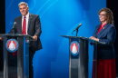 Candidates Phil Lyman and Rep. Celeste Maloy smile at the end of the 3rd Congressional District GOP primary debate in Salt Lake City, Utah, on June 1.